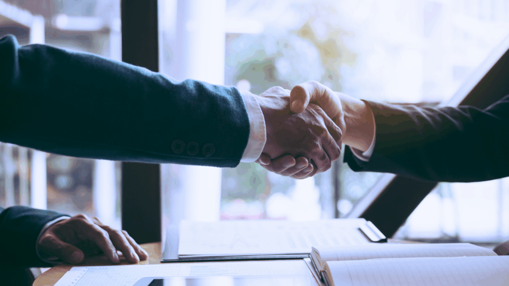 black and white person shaking hands